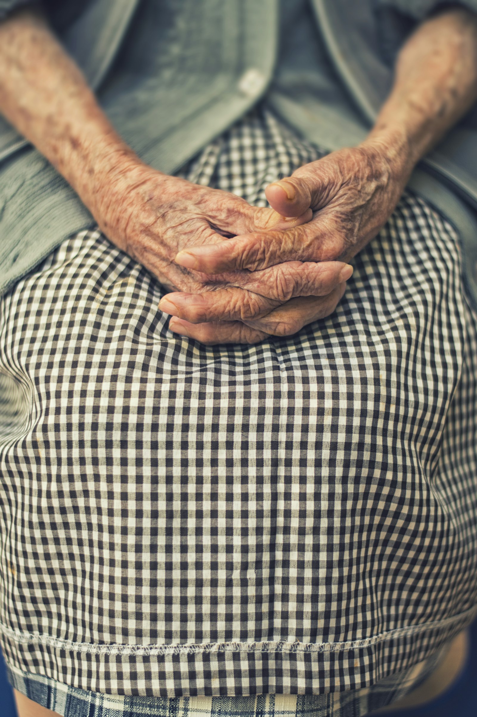 A person’s hand resting on a table