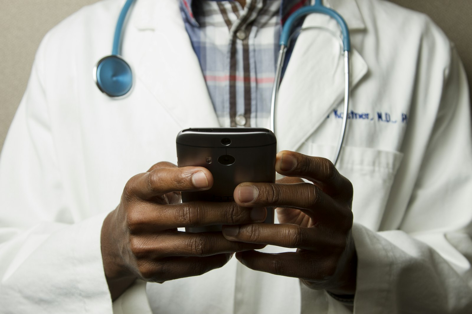 Healthcare provider holding a phone
