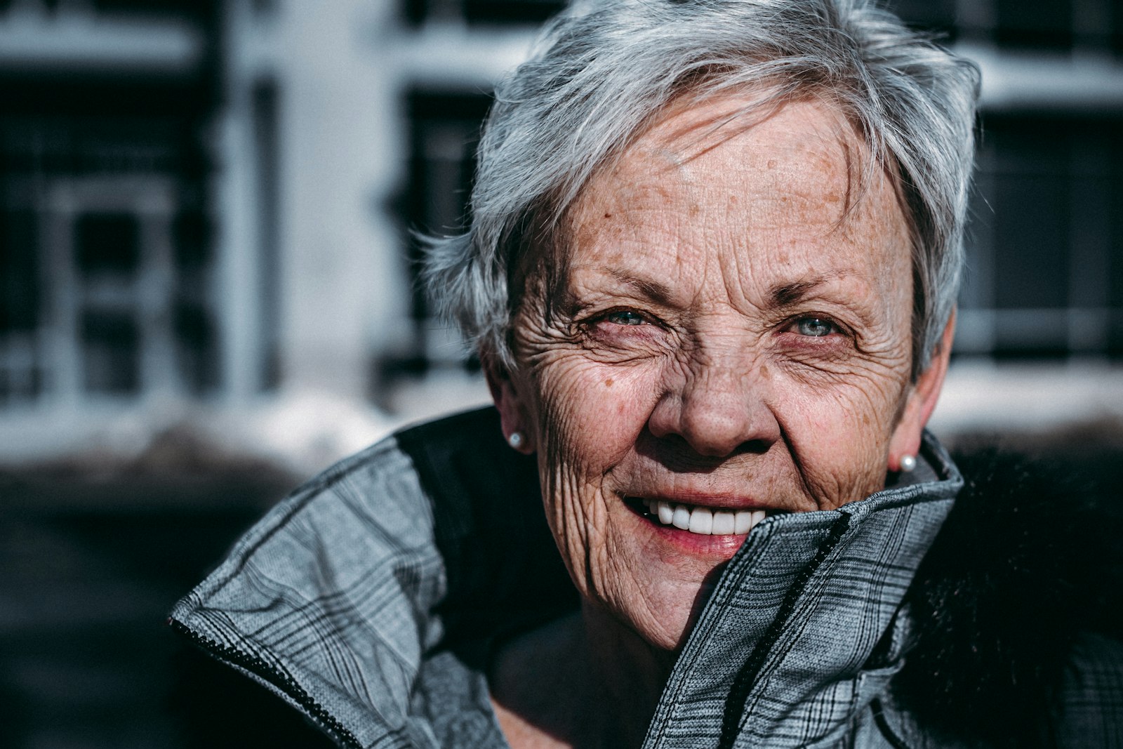 Smiling older woman, warm sunlight